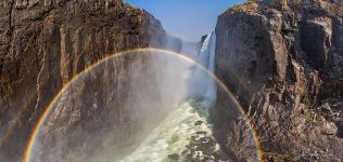 Rainbow in waterfall splashes. Victoria Falls, Zambia-Zimbabwe